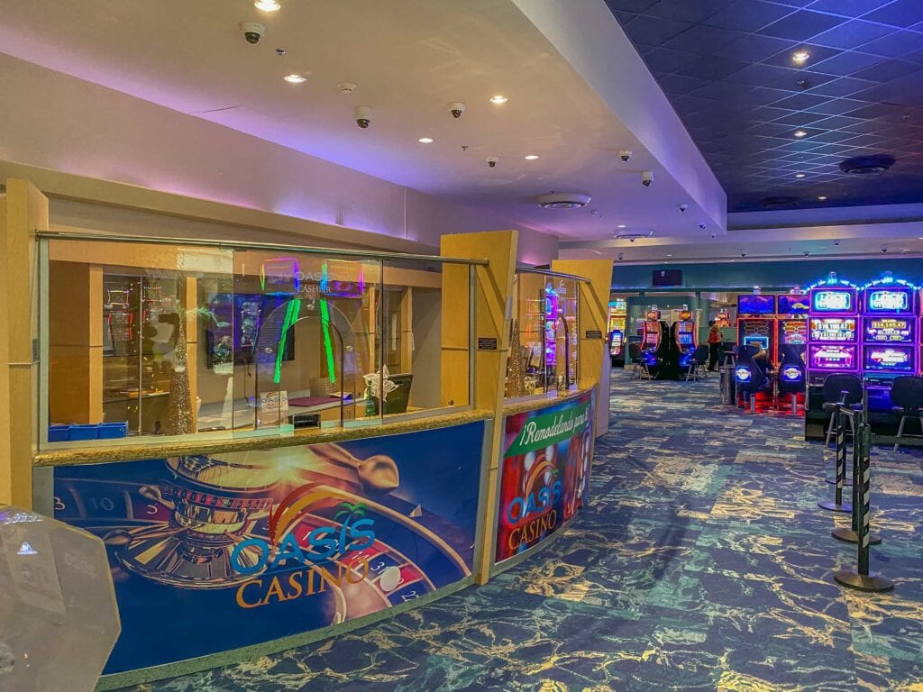 Oasis Casino front desk and slot machines